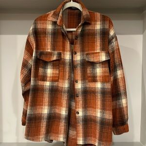 Blue B Collection plaid shacket. Orange, cream, brown plaid. Size medium.